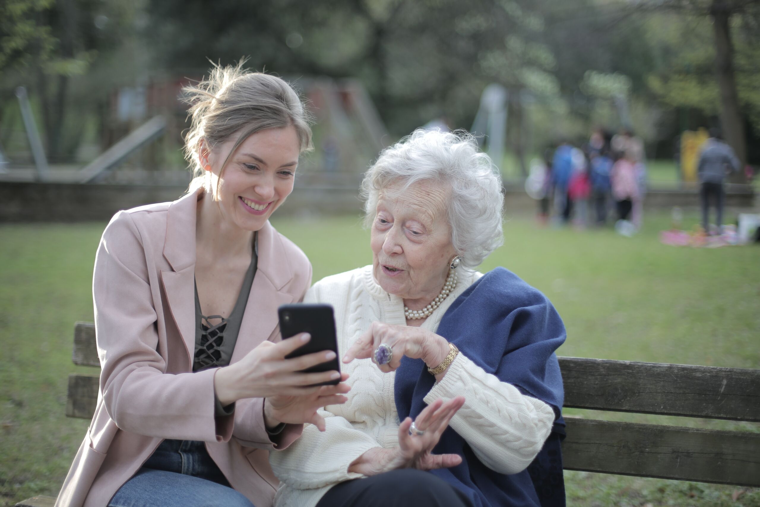 woman with elderly woman at the park